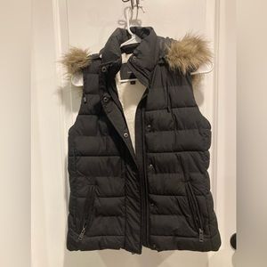 Shearling lined puffy vest with faux fur trimmed hood